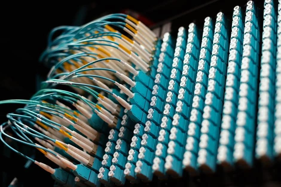 Rows of blue cables connect to round electrical ports, symbolizing MCP server integration with HubSpot.