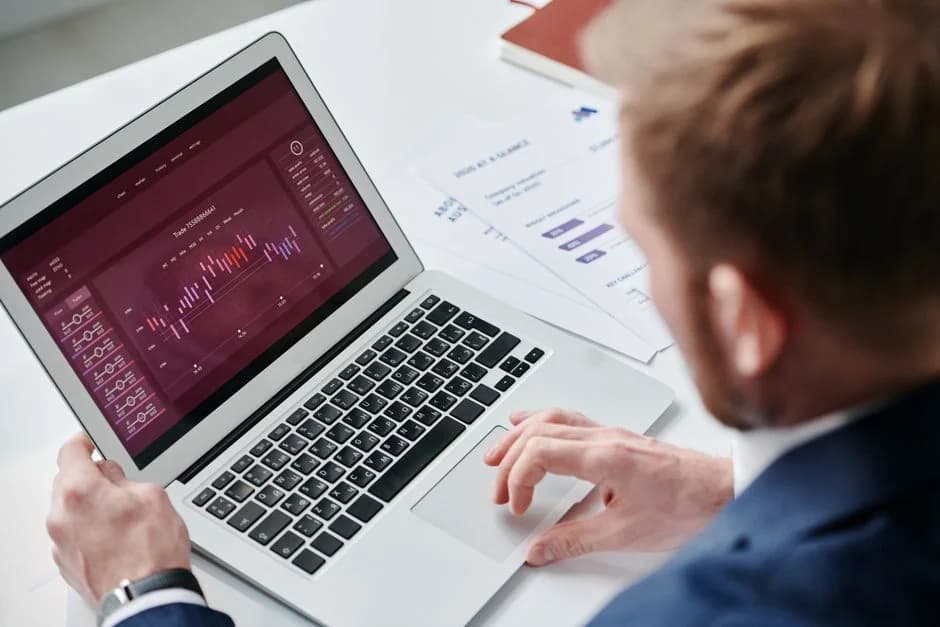 Insurance broker reviewing automated pipeline dashboard on a laptop